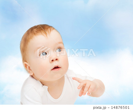 curious baby looking side 14876501