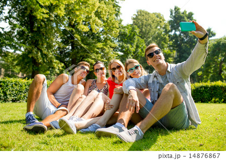 smiling friends with smartphone making selfie 14876867