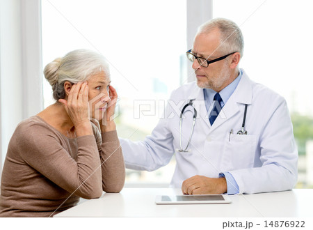 senior woman and doctor with tablet pc 14876922