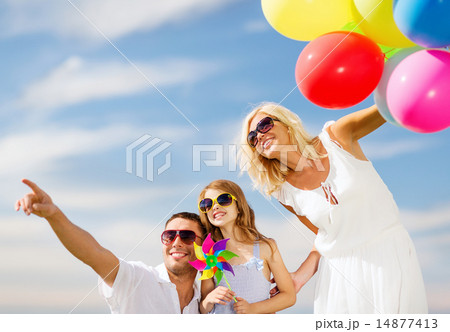 family with colorful balloons family with colorful balloons 14877413
