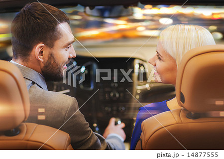 happy couple driving in car over night city 14877555