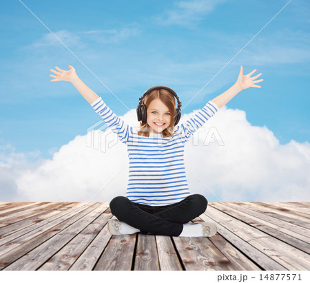 happy girl with headphones listening to music 14877571