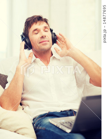 man with headphones listening to music 14877695