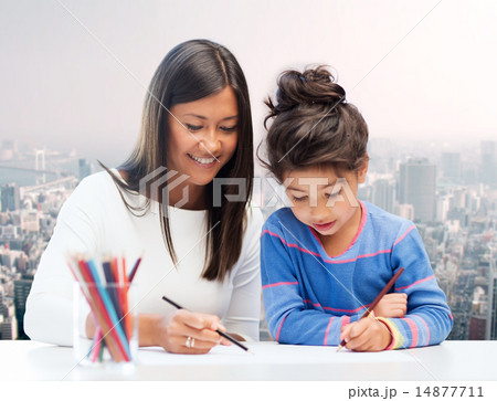 happy mother and daughter drawing with pencils happy mother and daughter drawing with pencils 14877711