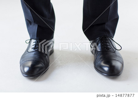 close up of man legs in elegant shoes with laces close up of man legs in elegant shoes with laces 14877877