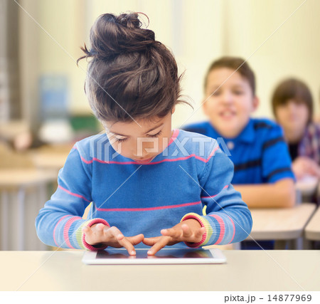 little school girl with tablet pc over classroom little school girl with tablet pc over classroom 14877969