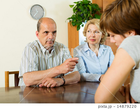 Mature parents scolding adult daughter 14879220