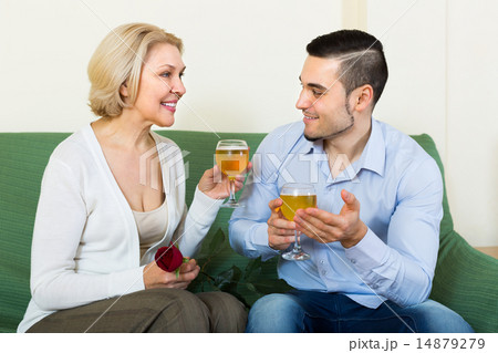 Mature woman with young guy indoors Mature woman with young guy indoors 14879279
