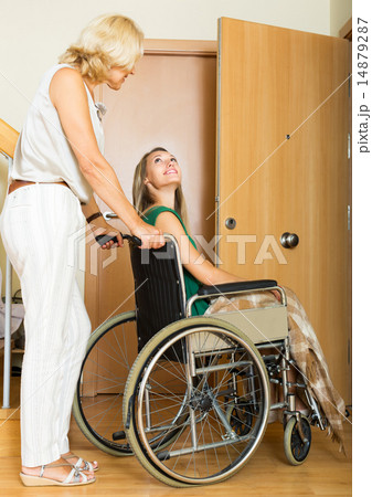 Social worker and disabled woman Social worker and disabled woman 14879287