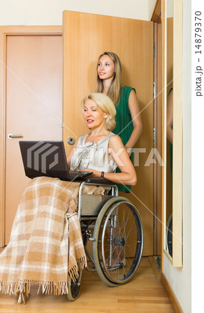 Social worker and invalid with laptop Social worker and invalid with laptop 14879370