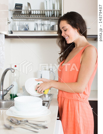 Housewife washing dishes 14879487