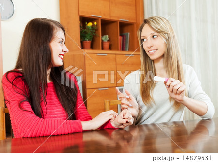 Happy girls with pregnancy test Happy girls with pregnancy test 14879631