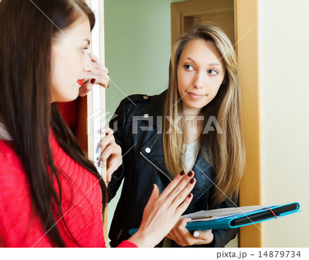 young employee polling among people at home young employee polling among people at home 14879734