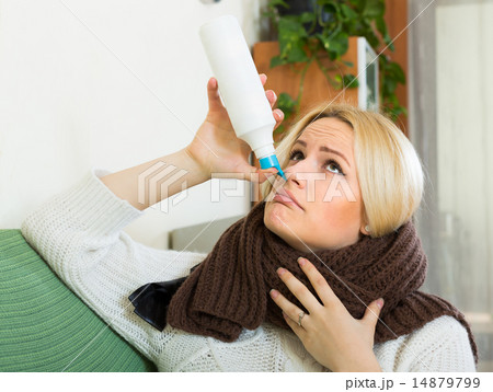 Young blonde with nasal spray 14879799