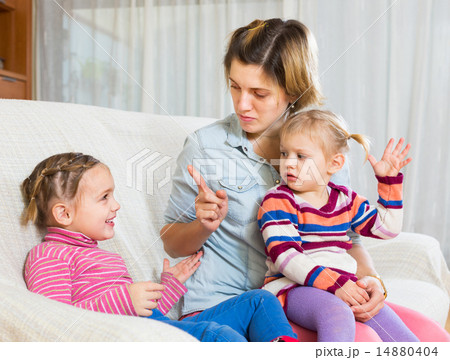 Angry woman shaming child Angry woman shaming child 14880404