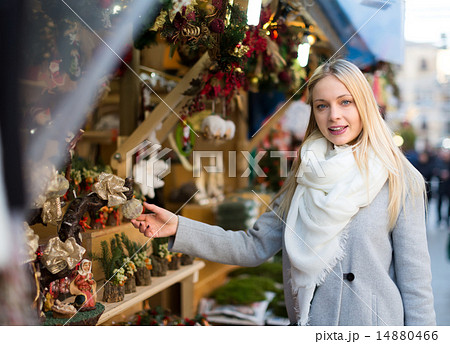 Blonde choosing christmas decorations Blonde choosing christmas decorations 14880466