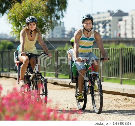 Family of four traveling by bicycles 14880838