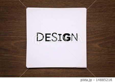 Paper with word " Design " on  wood backgroun 14885216