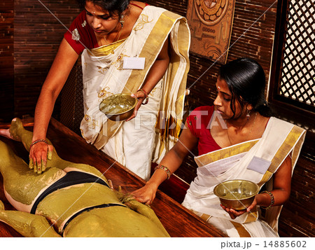 Woman having Ayurvedic body spa massage. Woman having Ayurvedic body spa massage. 14885602