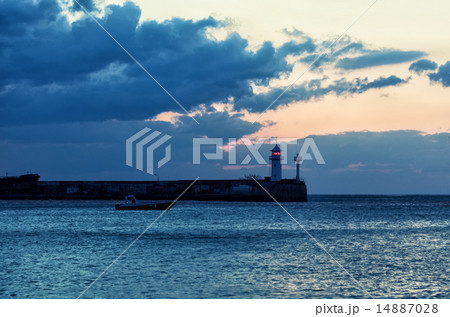 Beacon and the boat taking to the open sea at sunr Beacon and the boat taking to the open sea at sunr 14887028