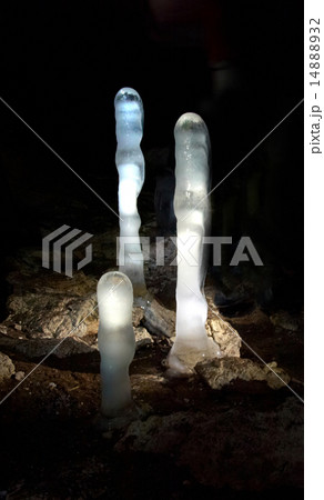 Luminescent ice stalagmites in the cave. 14888932