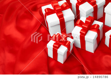 gift on red satin background 14890786
