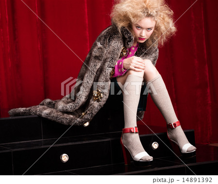 Beautiful blond woman in a fur 14891392