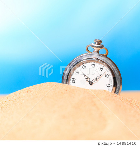 Alarm clock on the beach Alarm clock on the beach 14891410