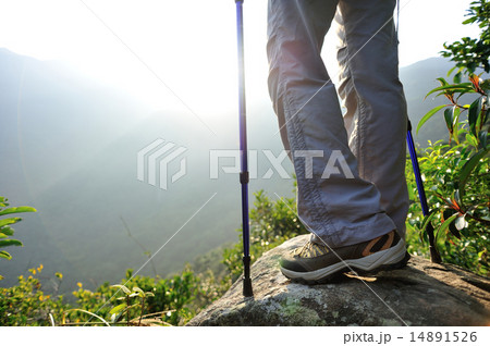 woman hiker legs stand on mountain peak rock 14891526