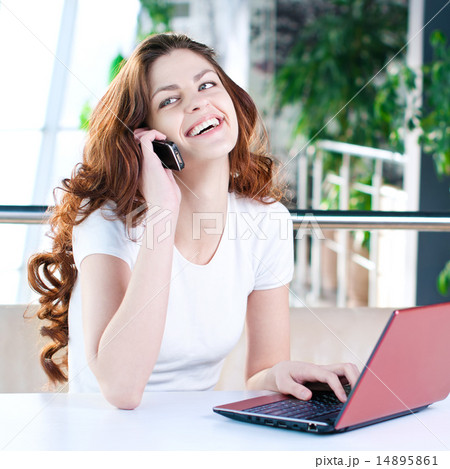 A young business woman sitting in a cafe A young business woman sitting in a cafe 14895861