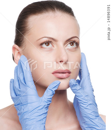 Beautician touch and exam health woman face Beautician touch and exam health woman face 14896391
