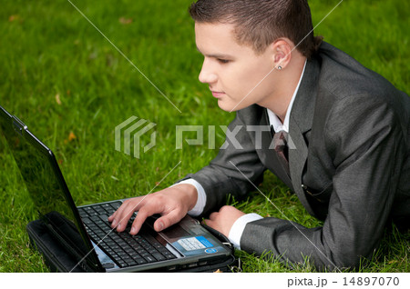 business man work on notebook at park. Student business man work on notebook at park. Student 14897070