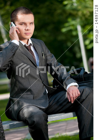 business man talk by mobile phone. Student 14897128