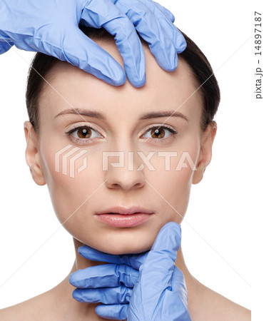 Beautician touch and exam health woman face. 14897187