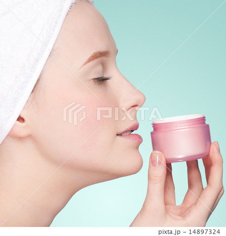 Beautiful woman tender jar of moisturizer cream 14897324