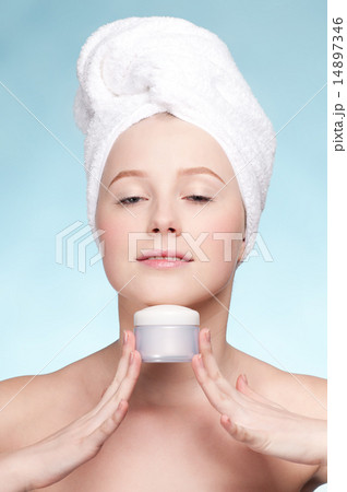 Beautiful woman tender jar of moisturizer cream 14897346