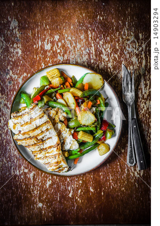 Grilled chicken with baked vegetables on rustic background 14903294