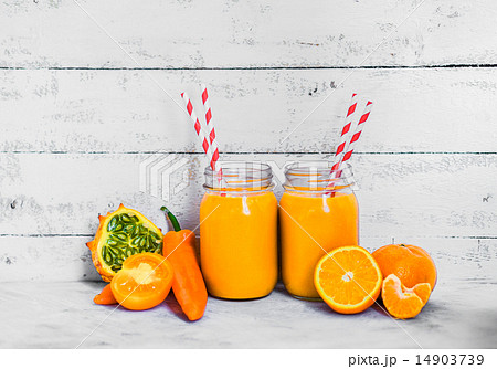 Orange smoothie on rustic background Orange smoothie on rustic background 14903739