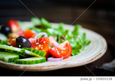 Vegetable salad on wooden background Vegetable salad on wooden background 14904338