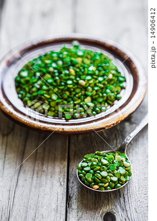 Organic split peas on wooden background Organic split peas on wooden background 14906412