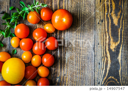 Colorful tomatoes on rustic background 14907547