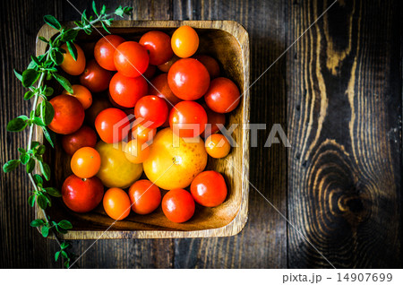 Colorful tomatoes on rustic background 14907699