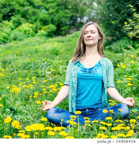Pretty woman meditate in the park Pretty woman meditate in the park 14908458
