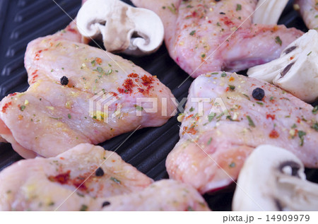 Raw chicken wings on the grill Raw chicken wings on the grill 14909979