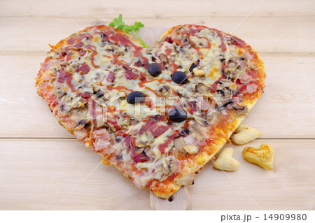 Heart shaped pizza on wood Heart shaped pizza on wood 14909980