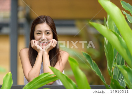Woman putting hands on both side of her face 14910511