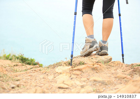 woman hiker hiking stand on seaside rock woman hiker hiking stand on seaside rock 14910837