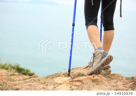 woman hiker hiking stand on seaside rock woman hiker hiking stand on seaside rock 14910839