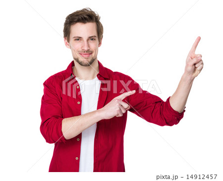 Happy young man pointing to blank space on the right Happy young man pointing to blank space on the right 14912457