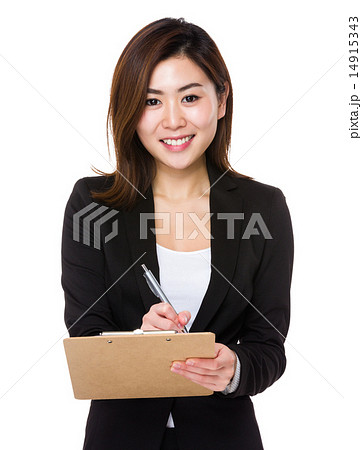 Asian businesswoman write on clipboard Asian businesswoman write on clipboard 14915343